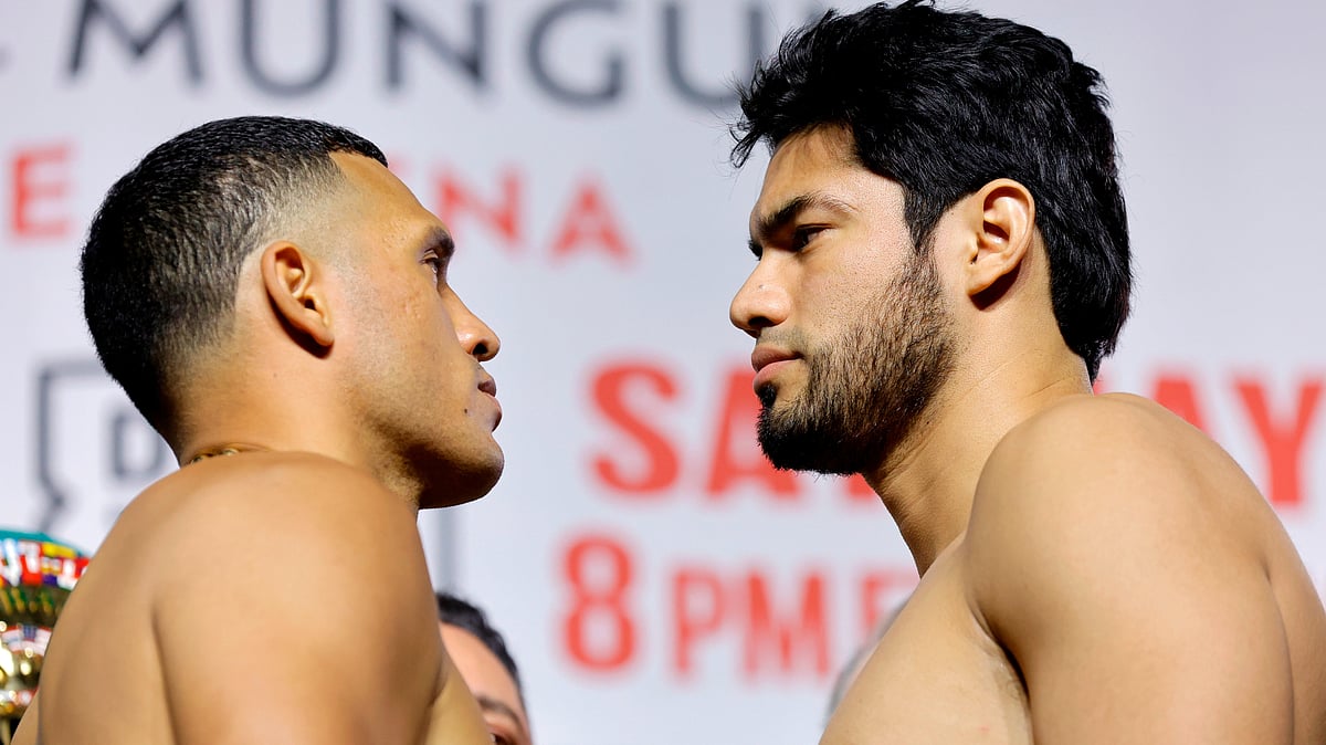 David Benavidez, left, faces off with WBA/WBO cruiserweight champion Gilberto Ramirez during a ceremonial weigh-in at MGM Grand Garden Arena - AP Photo
