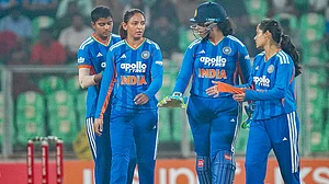 | Photo: PTI : India's captain Harmanpreet Kaur with teammates during the fifth T20 International cricket match of a series between India Women and Sri Lanka Women, at Greenfield International Stadium, in Thiruvananthapuram.