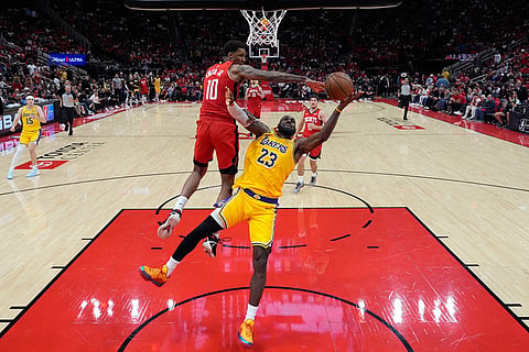 Houston Rockets forward Jabari Smith Jr. (10) defends against Los Angeles Lakers forward LeBron James (23) during the second half of Game 6 of a first-round NBA playoffs basketball series in Houston.