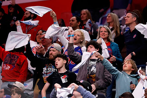 Fans wave rally towels during the second half of a win by the Detroit Pistons over the Orlando Magic in Game 5 of a first-round NBA basketball playoffs series in Detroit.
