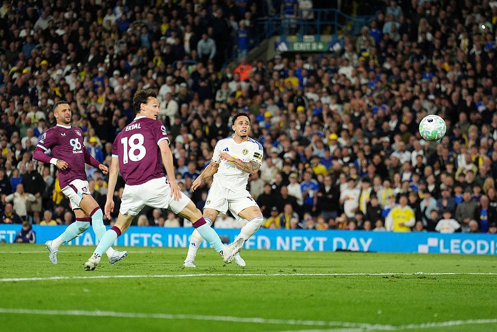 Leeds United's Noah Okafor, right, scores their side's second goal during the Premier League match between Leeds United and Burnley, in Leeds, England. - | Photo: Martin Rickett/PA via AP