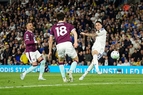 Leeds United's Noah Okafor, right, scores their side's second goal during the Premier League match between Leeds United and Burnley, in Leeds, England.