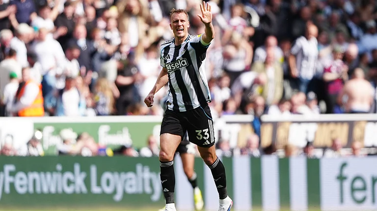 Newcastle United's Dan Burn celebrates scoring their side's second goal of the game during their English Premier League soccer match against Brighton & Hove Albion in Newcastle, England, Saturday, May 2, 2026. - | Photo: AP/Owen Humphreys