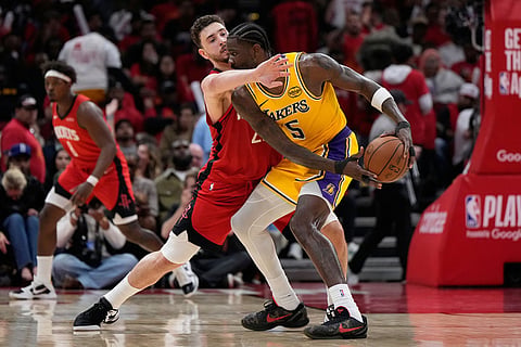 Houston Rockets center Alperen Sengun (28) defends against Los Angeles Lakers center Deandre Ayton (5) during the second half of Game 6 of a first-round NBA playoffs basketball series in Houston.