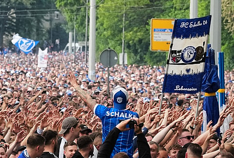 FC Schalke 04 supporters march to the stadium ahead of their 2. Bundesliga match against Fortuna Duesseldorf, where their club can secure early promotion back to the Bundesliga with a win in the evening at the Arena in Gelsenkirchen, Germany.