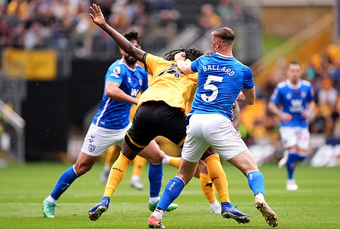 Sunderland's Daniel Ballard pulls the hair of Wolverhampton Wanderers' Tolu Arokodare resulting in a red card during their English Premier League soccer match in Wolverhampton, England.