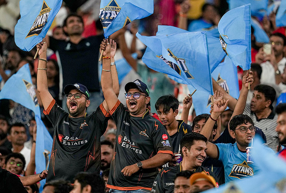 Gujarat Titans' fans cheer ahead of the Indian Premier League (IPL) 2026 T20 cricket match between Gujarat Titans and Punjab Kings, in Ahmedabad.
 - | Photo: PTI/Arun Sharma