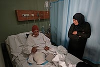Israeli Strikes Kill seven In Lebanon As Catholic Convent Is Demolished Hussein Malla; AP : Sanaa Khalil, 35, a Syrian farmer who lost her two legs in the past days by an Israeli airstrike while she was working at a banana plantation, lies on a bed as she is assisted by a relative at a hospital in the southern port city of Tyre, Lebanon, Friday, May 1, 2026.
