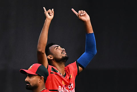 Bangladesh's Shoriful Islam celebrates the wicket of New Zealand's Katene Clarke during the third T20 international cricket match between Bangladesh and New Zealand in Mirpur, Bangladesh.