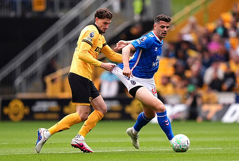 Wolverhampton Wanderers' Santiago Bueno, left, Sunderland's Granit Xhaka battle for the ball during their English Premier League soccer match in Wolverhampton, England.
