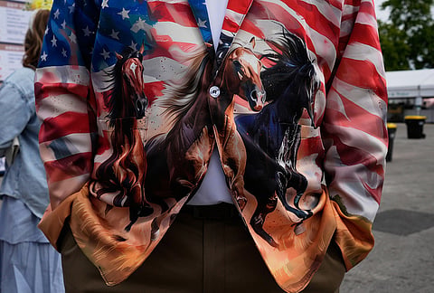 A race fan wears a colorful jacket before the 152nd running of the Kentucky Derby horse race at Churchill Downs, in Louisville, Kentucky. 