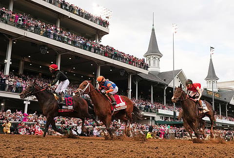 Jockey Jose L. Ortiz celebrates after riding Golden Tempo (19) to victory the 152nd running of the Kentucky Derby horse race at Churchill Downs, in Louisville, Kentucky.
