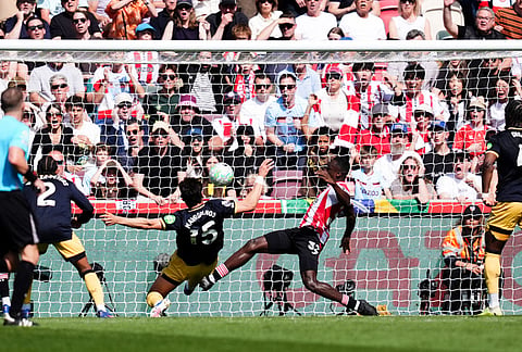 West Ham United's Konstantinos Mavropanos scores an own goal during their English Premier League soccer match against Brentford in London.