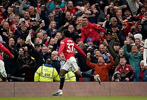 | Photo: AP/Dave Thompson : Manchester United's Kobbie Mainoo celebrates after scoring his side's third goal during the English Premier League soccer match between Manchester United and Liverpool in Manchester, England.