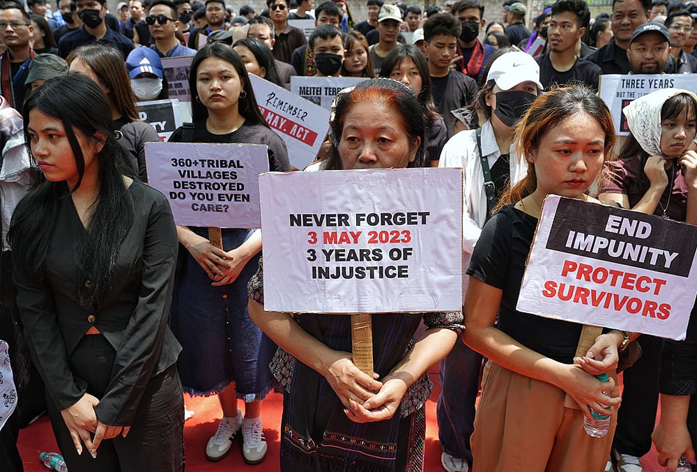 People hold placards during a protest on the third anniversary of the Manipur violence, at Jantar Mantar, in New Delhi. - | Photo: Suresh K. Pandey/Outlook