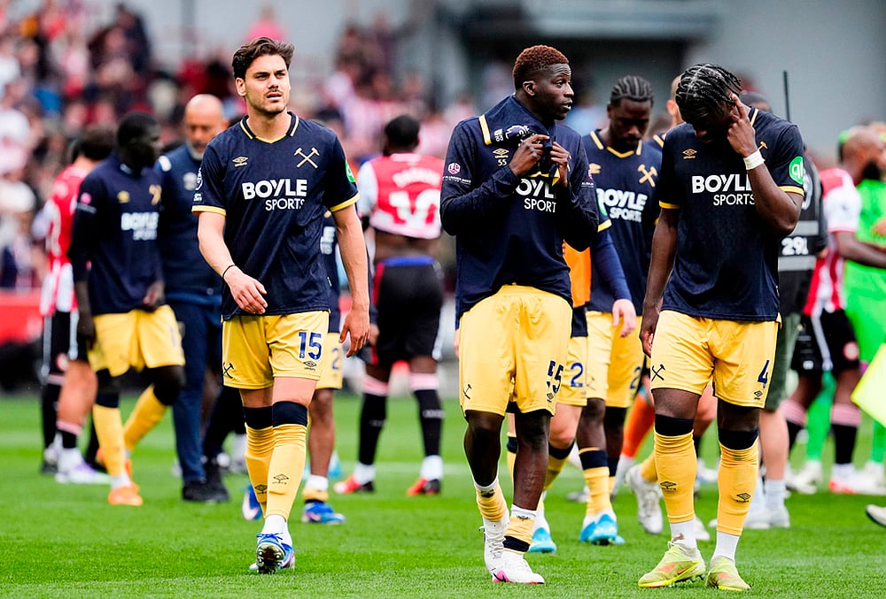 West Ham United's Konstantinos Mavropanos, left, looks dejected with teammates following the English Premier League soccer match between Brentford and West Ham United in London.  - | Photo: Nick Potts/PA via AP
