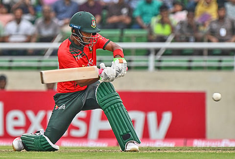 Bangladesh's Mahedi Hasan plays a shot during the third T20 international cricket match between Bangladesh and New Zealand in Mirpur, Bangladesh.