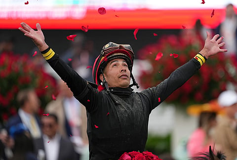 Jockey Jose L. Ortiz celebrates after riding Golden Tempo to victory in the 152nd running of the Kentucky Derby horse race at Churchill Downs in Louisville, Kentucky.