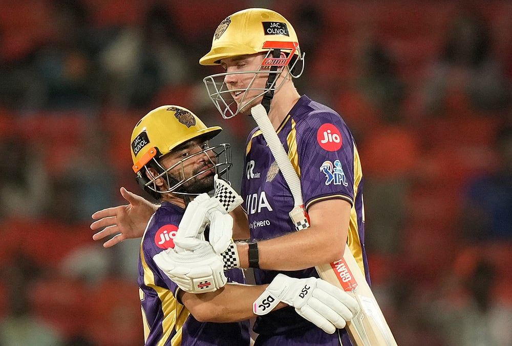 Kolkata Knight Riders' Rinku Singh, left and Cameron Green celebrate their win over Sunrisers Hyderabad during the Indian Premier League cricket match in Hyderabad. - | Photo: AP/Mahesh Kumar A.