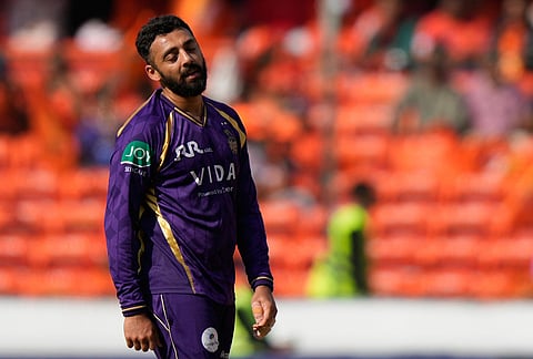Kolkata Knight Riders' Varun Chakaravarthy reacts after taking the wicket of Sunrisers Hyderabad's Travis Head during the Indian Premier League cricket match between Sunrisers Hyderabad and Kolkata Knight Riders in Hyderabad.

