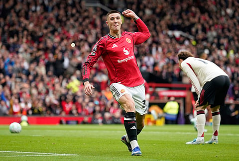Manchester United's Benjamin Sesko celebrates after scoring his side's second goal during the English Premier League soccer match between Manchester United and Liverpool in Manchester, England.
