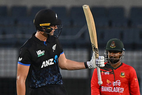 New Zealand's Bevon Jacobs celebrates his fifty runs during the third T20 international cricket match between Bangladesh and New Zealand in Mirpur, Banglades.