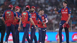 AP/Ajit Solanki : Marco Jansen, right, celebrates the wicket of Rahul Tewatia with teammates during the Indian Premier League match between Gujarat Titans and Punjab Kings in Ahmedabad.