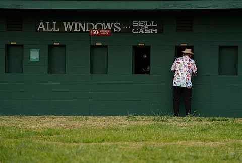 A fan places a bet before the 152nd running of the Kentucky Derby horse race at Churchill Downs, in Louisville, Kentucky.
