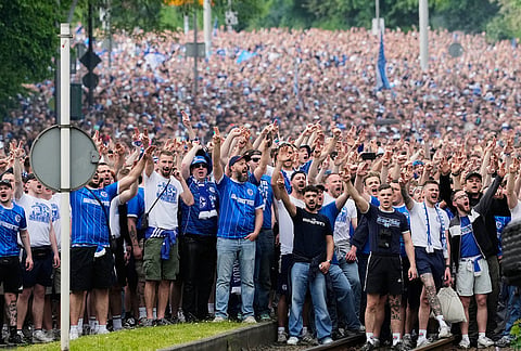FC Schalke 04 supporters march to the stadium ahead of their 2. Bundesliga match against Fortuna Duesseldorf, where their club can secure early promotion back to the Bundesliga with a win in the evening at the Arena in Gelsenkirchen, Germany.