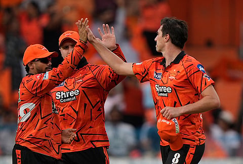 Sunrisers Hyderabad's captain Pat Cummins, right, celebrates with teammates the wicket of Kolkata Knight Riders' Finn Allen during the Indian Premier League cricket match between Sunrisers Hyderabad and Kolkata Knight Riders in Hyderabad.