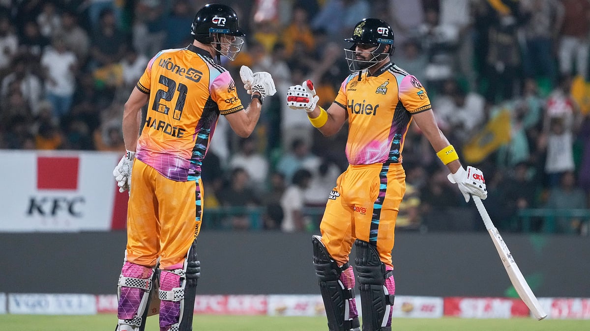 Peshawar Zalmi's Abdul Samad, right, celebrates with Aaron Hardie after hitting a six during the Pakistan Super League final cricket match between Peshawar Zalmi and Hyderabad Kingsmen, in Lahore, Pakistan, Sunday, May 3, 2026 - (AP Photo/K.M. Chaudary)