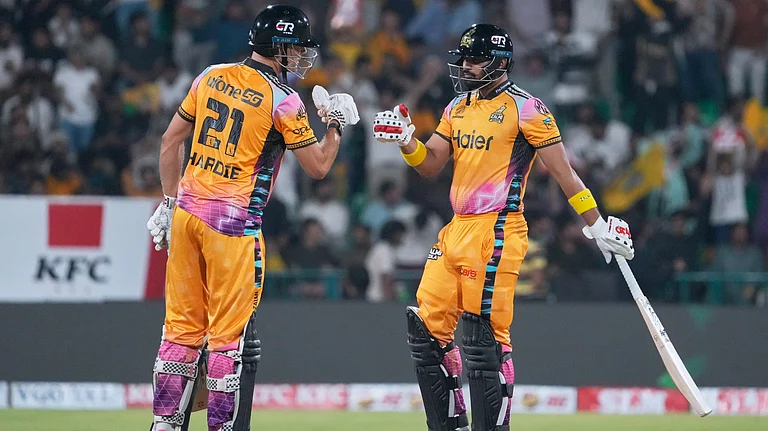 Peshawar Zalmi's Abdul Samad, right, celebrates with Aaron Hardie after hitting a six during the Pakistan Super League final cricket match between Peshawar Zalmi and Hyderabad Kingsmen, in Lahore, Pakistan, Sunday, May 3, 2026 - (AP Photo/K.M. Chaudary)