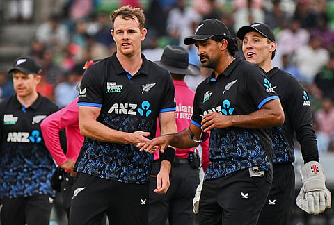 New Zealand's Josh Clarkson, centre, celebrates with teammates the wicket of Bangladesh's Shamim Hossain during the third T20 international cricket match between Bangladesh and New Zealand in Mirpur, Bangladesh.