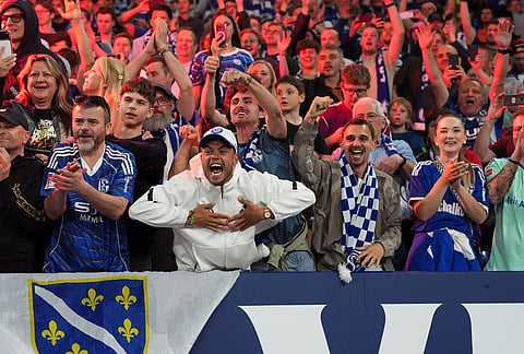 Schalke fans celebrate at the end of the German Bundesliga 2 soccer match between FC Schalke 04 and Fortuna Duesseldorf in Gelsenkirchen, Germany.