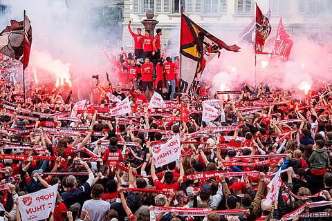 FC Thun players and fans celebrate winning the championship title on the Rathausplatz in Thun, Switzerland.