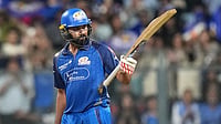AP/Rafiq Maqbool : Rohit Sharma celebrates his fifty runs during the Indian Premier League match between Mumbai Indians and Lucknow Super Giants in Mumbai.
