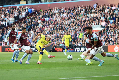 Tottenham's Richarlison, center left, attempts a shot on goal during the English Premier League soccer match between Aston Villa and Tottenham Hotspur in Birmingham, England.