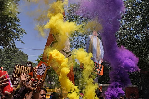 BJP supporters celebrate in BJP Delhi office.