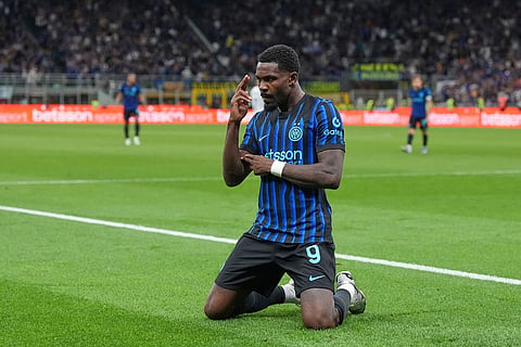 Inter Milan's Marcus Thuram celebrates after scoring his side's opening goal during a Serie A soccer match between Inter Milan and Parma, in Milan, Italy.