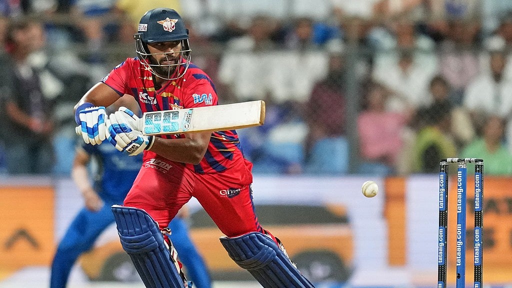 Photo: AP : Nicholas Pooran plays a shot during the Indian Premier League match between Mumbai Indians and Lucknow Super Giants in Mumbai.