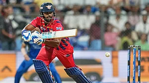 Photo: AP : Nicholas Pooran plays a shot during the Indian Premier League match between Mumbai Indians and Lucknow Super Giants in Mumbai.