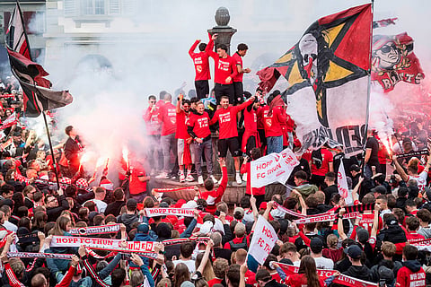 FC Thun players and fans celebrate winning the championship title on the Rathausplatz in Thun, Switzerland.