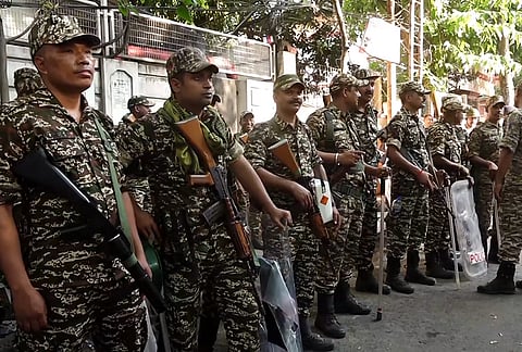 Security personnel outside a vote counting centre during the West Bengal Assembly election results day, in Kolkata.
