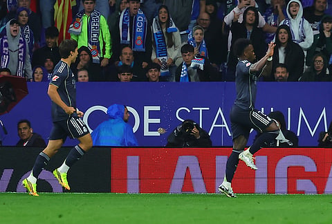 Real Madrid's Gonzalo Garcia, left, and Vinicius Junior celebrate after scoring during the La Liga soccer match between Espanyol and Real Madrid in Barcelona, Spain.