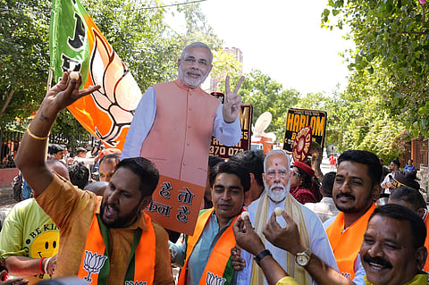 BJP supporters celebrate in BJP Delhi office.