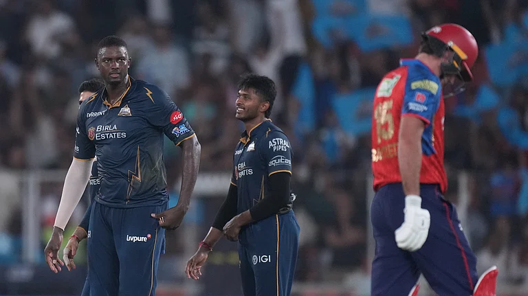Gujarat Titans' Jason Holder celebrates the wicket of Punjab Kings' Xavier Bartlett during the Indian Premier League cricket match - Ajit Solanki/AP