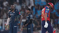 Ajit Solanki/AP : Gujarat Titans' Jason Holder celebrates the wicket of Punjab Kings' Xavier Bartlett during the Indian Premier League cricket match