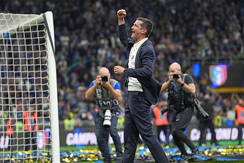 Inter Milan's head coach Cristian Chivu celebrates their victory at the Serie A soccer match between Inter Milan and Parma, in Milan, Italy.