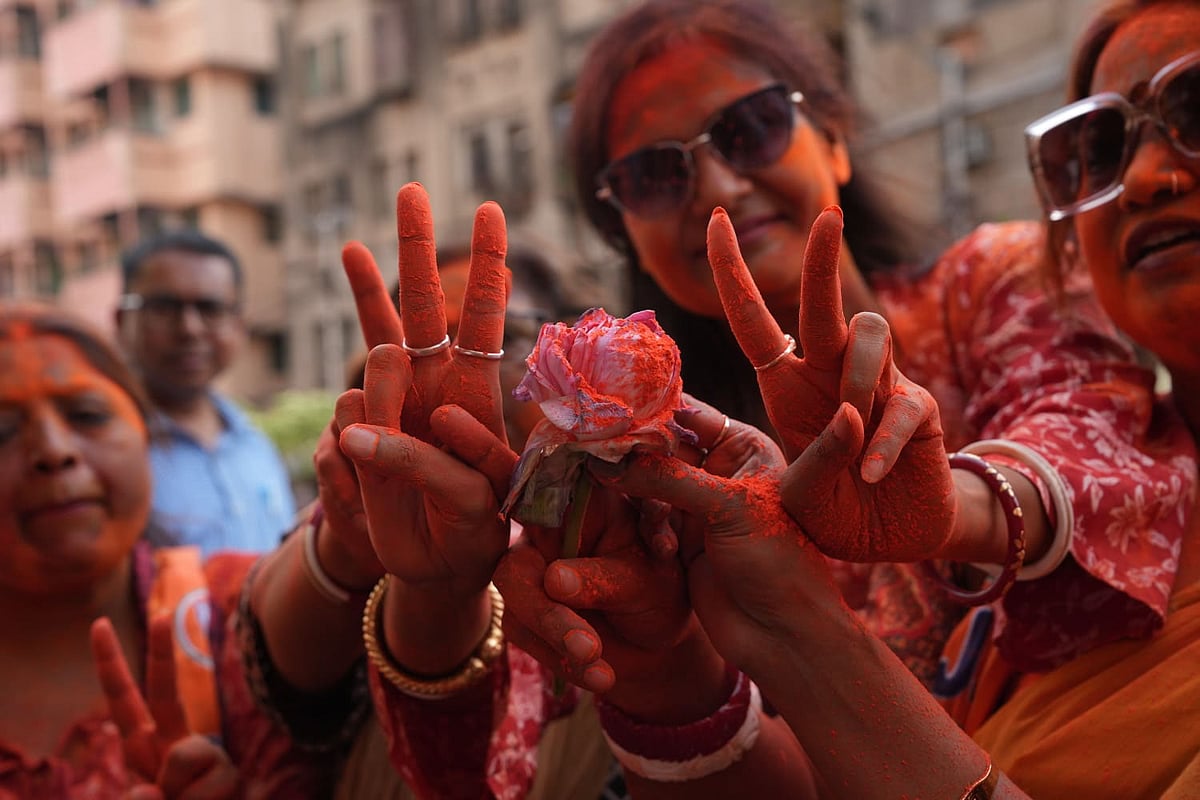 BJP workers celebrate as the party takes lead during vote tabulation on the day of Assembly election results
