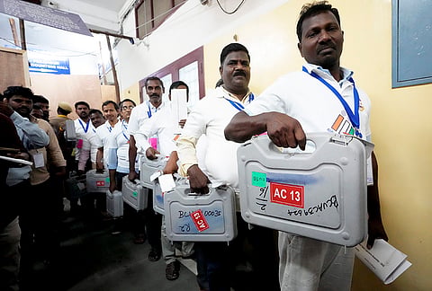 Election officials at Kolathur strong room during the counting of votes for the Assembly elections at a counting centre, in Chennai.